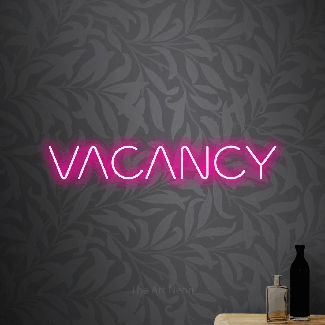 LED neon sign reading “VACANCY”, arranged in a single line.