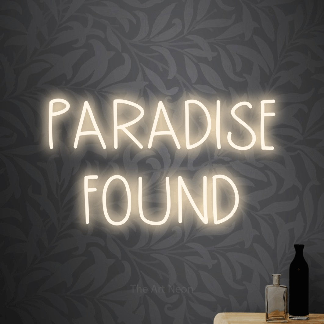 LED neon sign reading “PARADISE FOUND”, arranged in two lines.