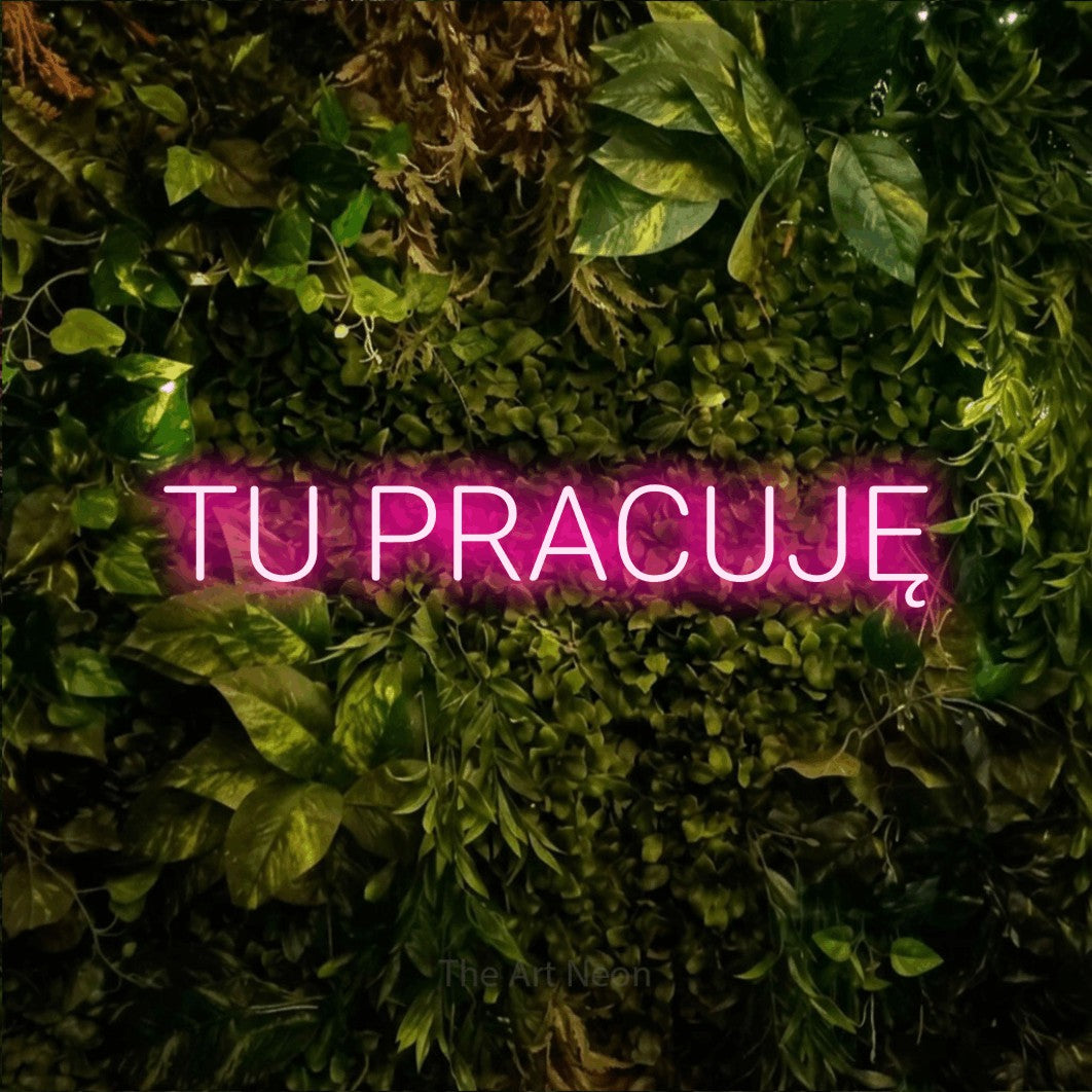 LED neon sign reading “TU PRACUJĘ”, arranged in a single line.