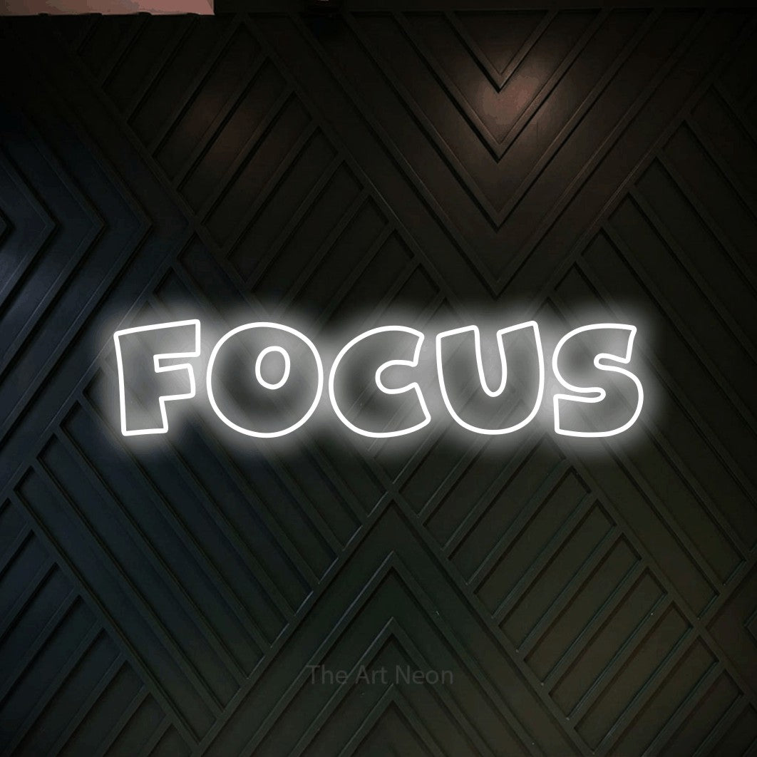 LED neon sign reading “FOCUS”, arranged in a single line.