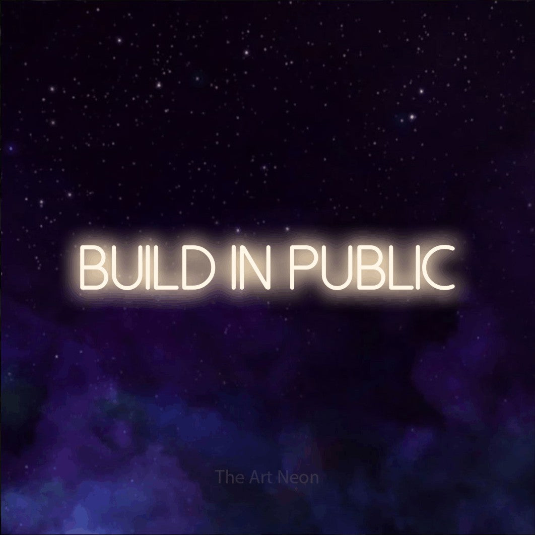 LED neon sign reading “Build in Public”, arranged in a single line.