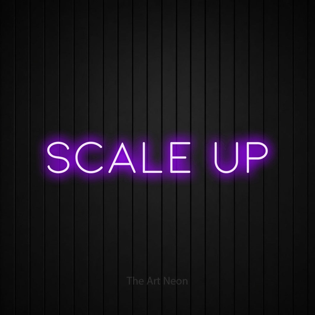 LED neon sign reading “scale up”, arranged in a single line.