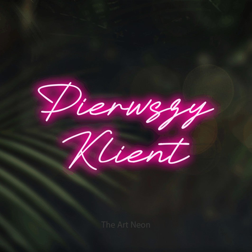 LED neon sign reading “Pierwszy Klient”, arranged in two lines.