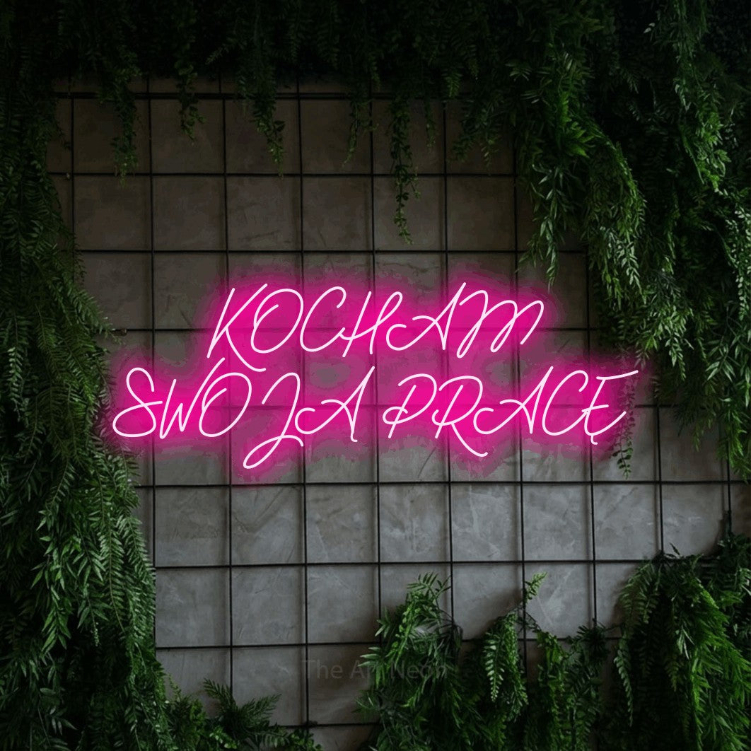 LED neon sign reading “KOCHAM SWOJĄ PRACĘ”, arranged in two lines.