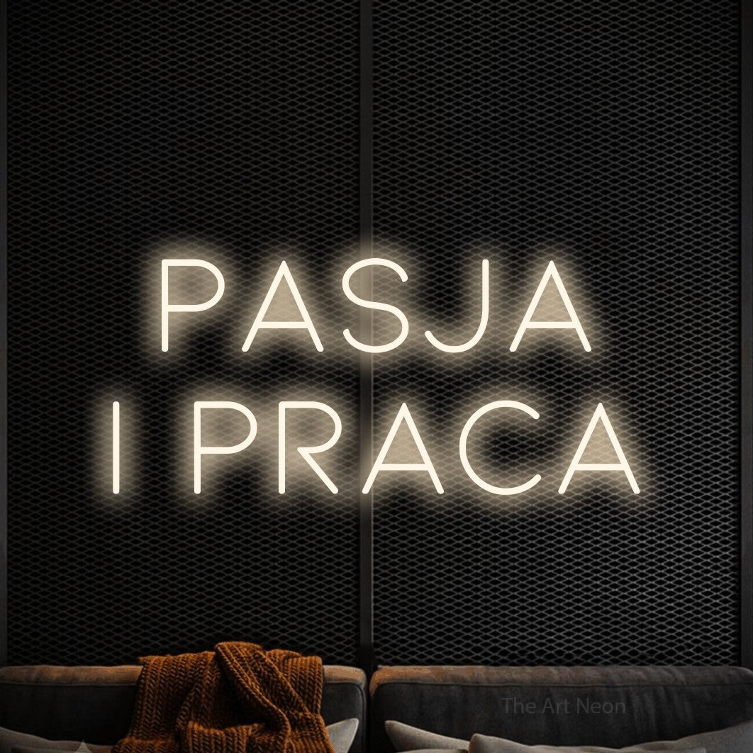 LED neon sign reading “PASJA i praca”, arranged in two lines.