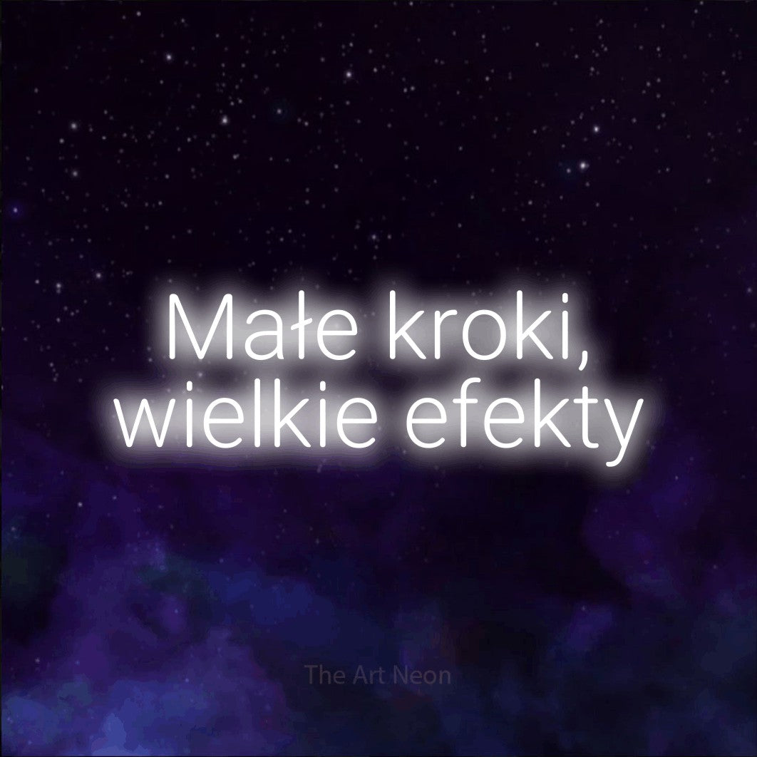 LED neon sign reading “Małe kroki, wielkie efekty”, arranged in two lines.