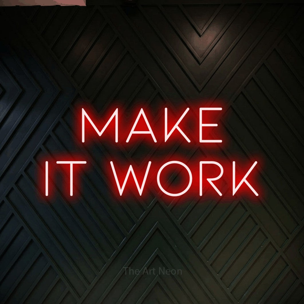 LED neon sign reading “make it work”, arranged in two lines.