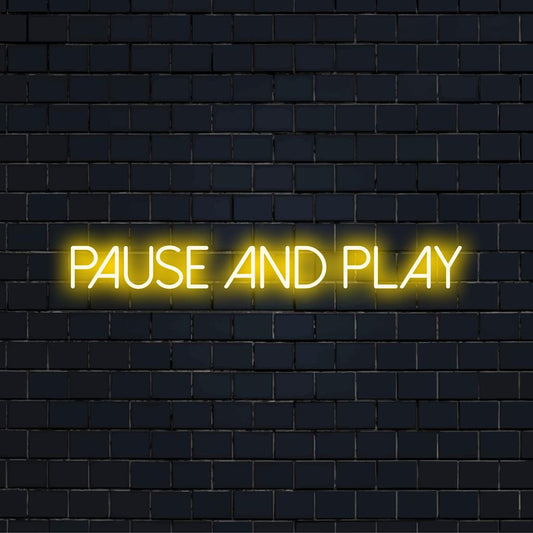 Custom LED neon wall art reading Pause And Play, perfect for creating a vibrant and personalized space.