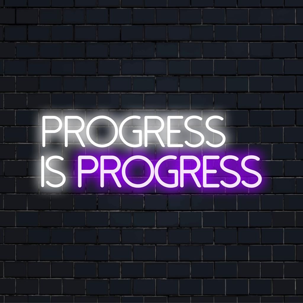 Custom LED neon sign with the text Progress Is Progress in vibrant colors, ideal for modern decor and inspiration.