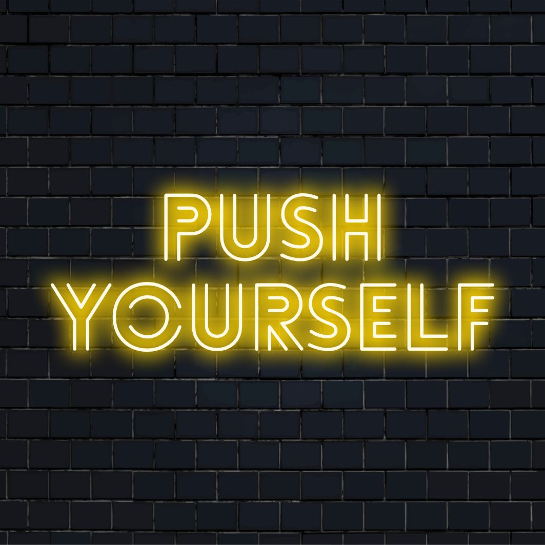 Vibrant Push Yourself LED neon sign, perfect for motivational decor; eye-catching neon light statement for any space.