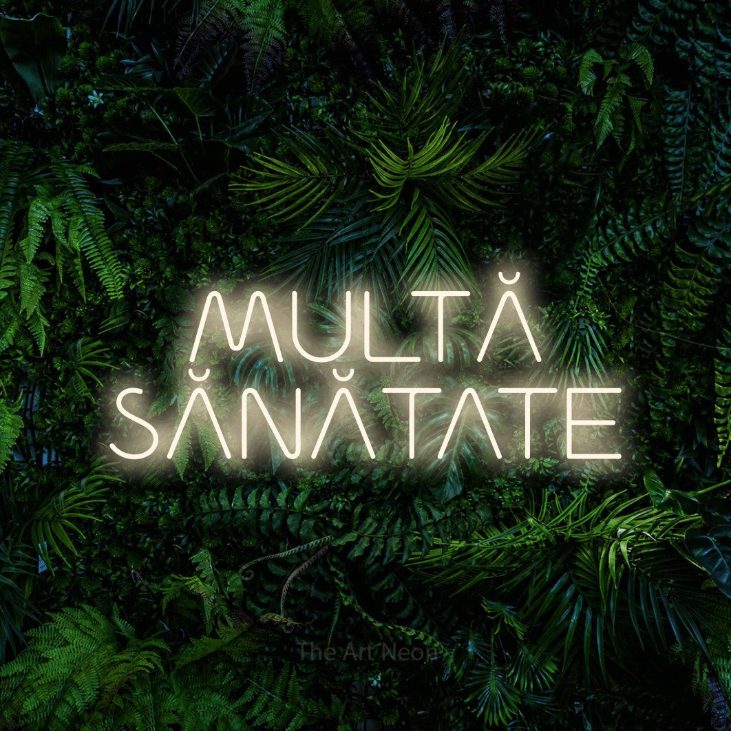 LED neon sign reading “MULTĂ SĂNĂTATE”, arranged in two lines.