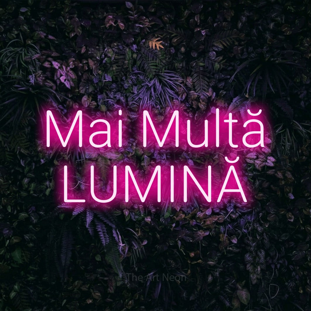 LED neon sign reading “Mai Multă LUMINĂ”, arranged in two lines.
