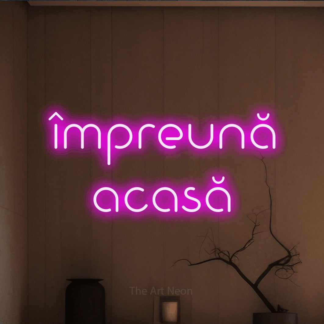 LED neon sign reading “împreună acasă”, arranged in two lines.