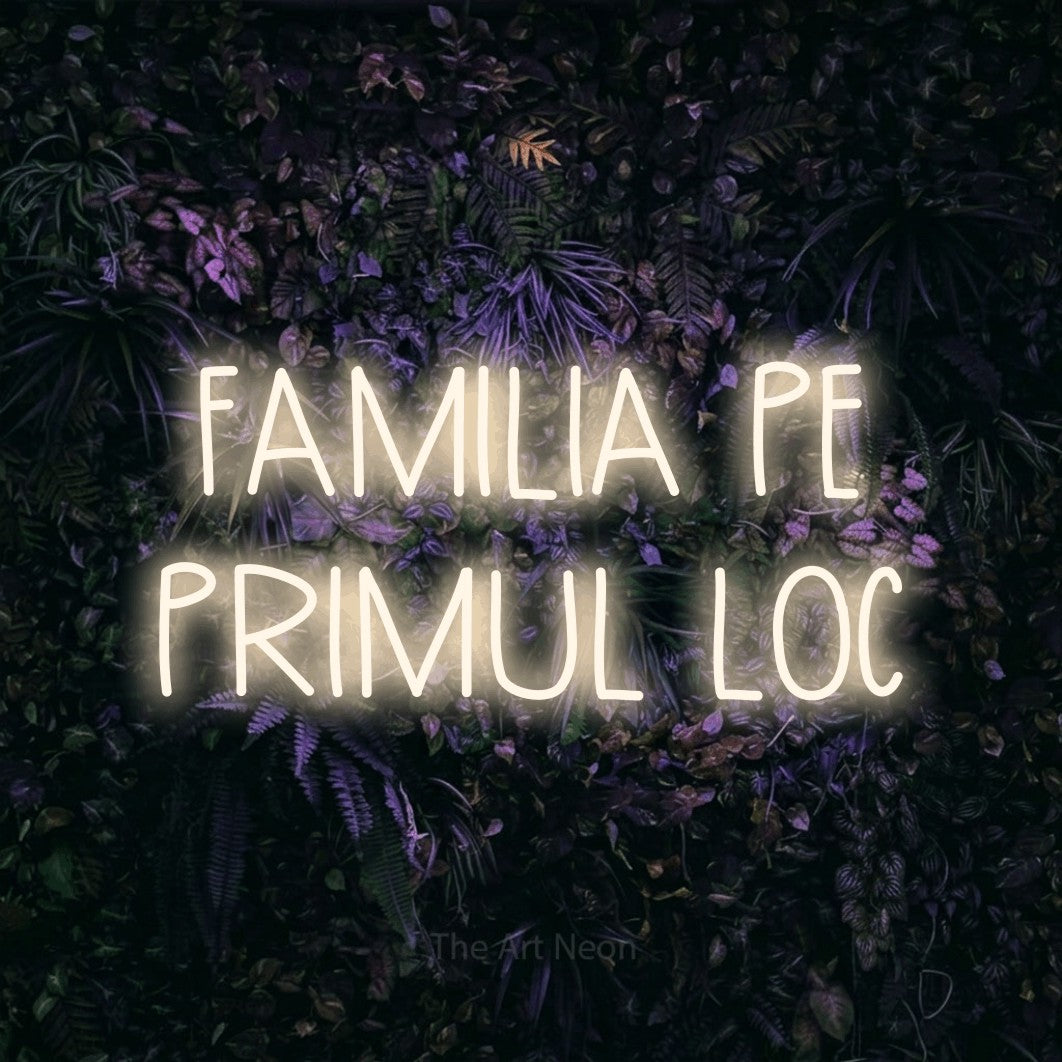 LED neon sign reading “FAMILIA PE PRIMUL LOC”, arranged in two lines.