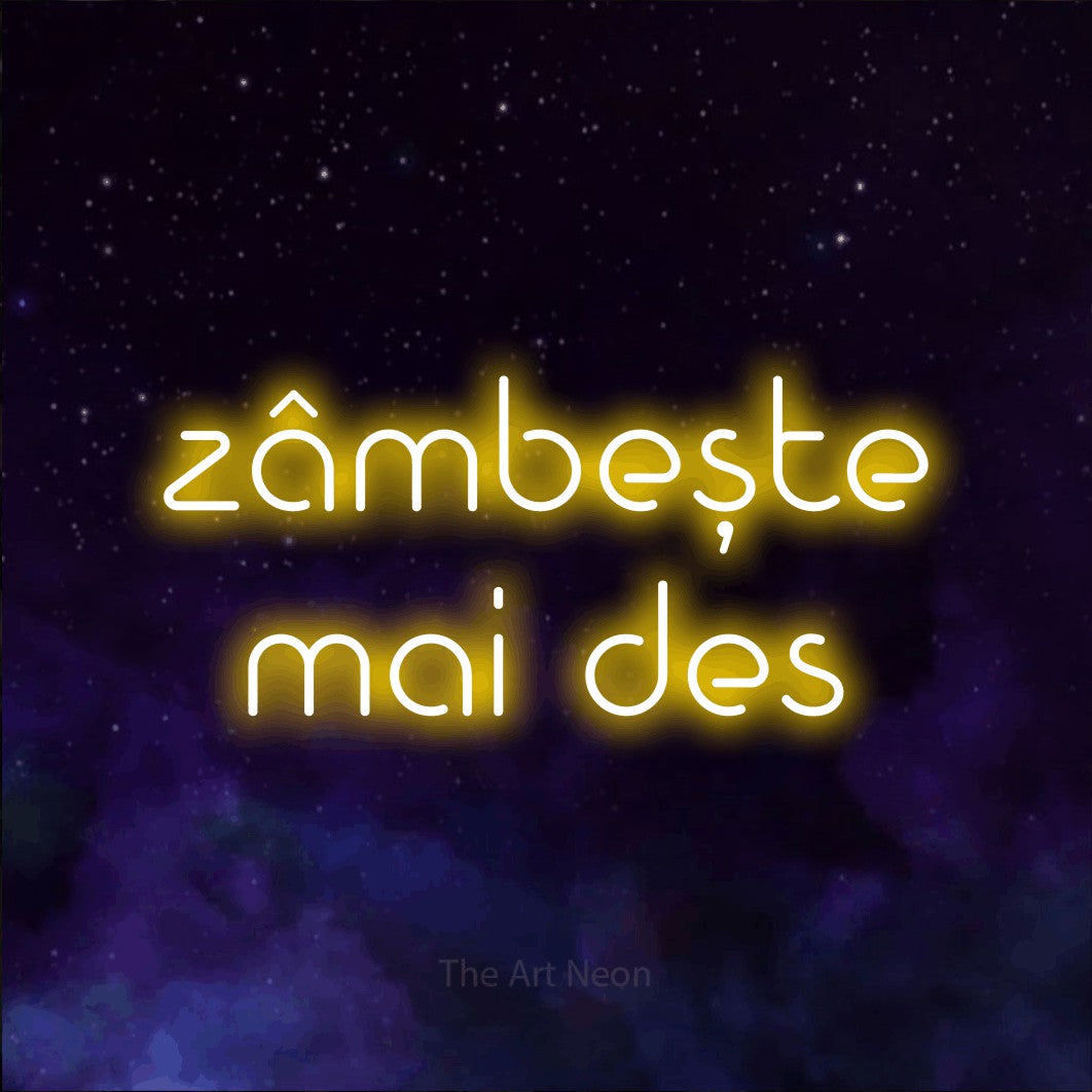 LED neon sign reading “zâmbește mai des”, arranged in two lines.