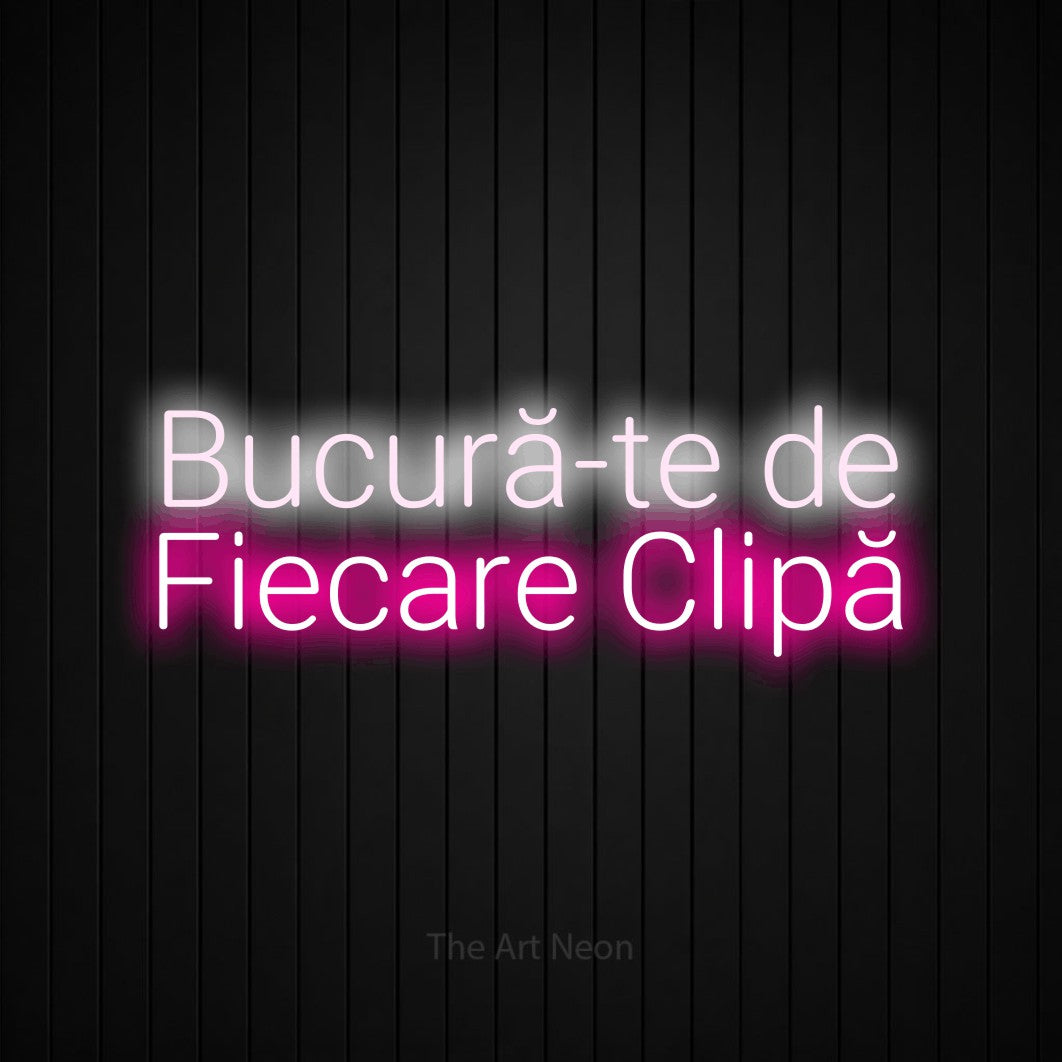 LED neon sign reading “Bucură-te de Fiecare Clipă”, arranged in two lines.
