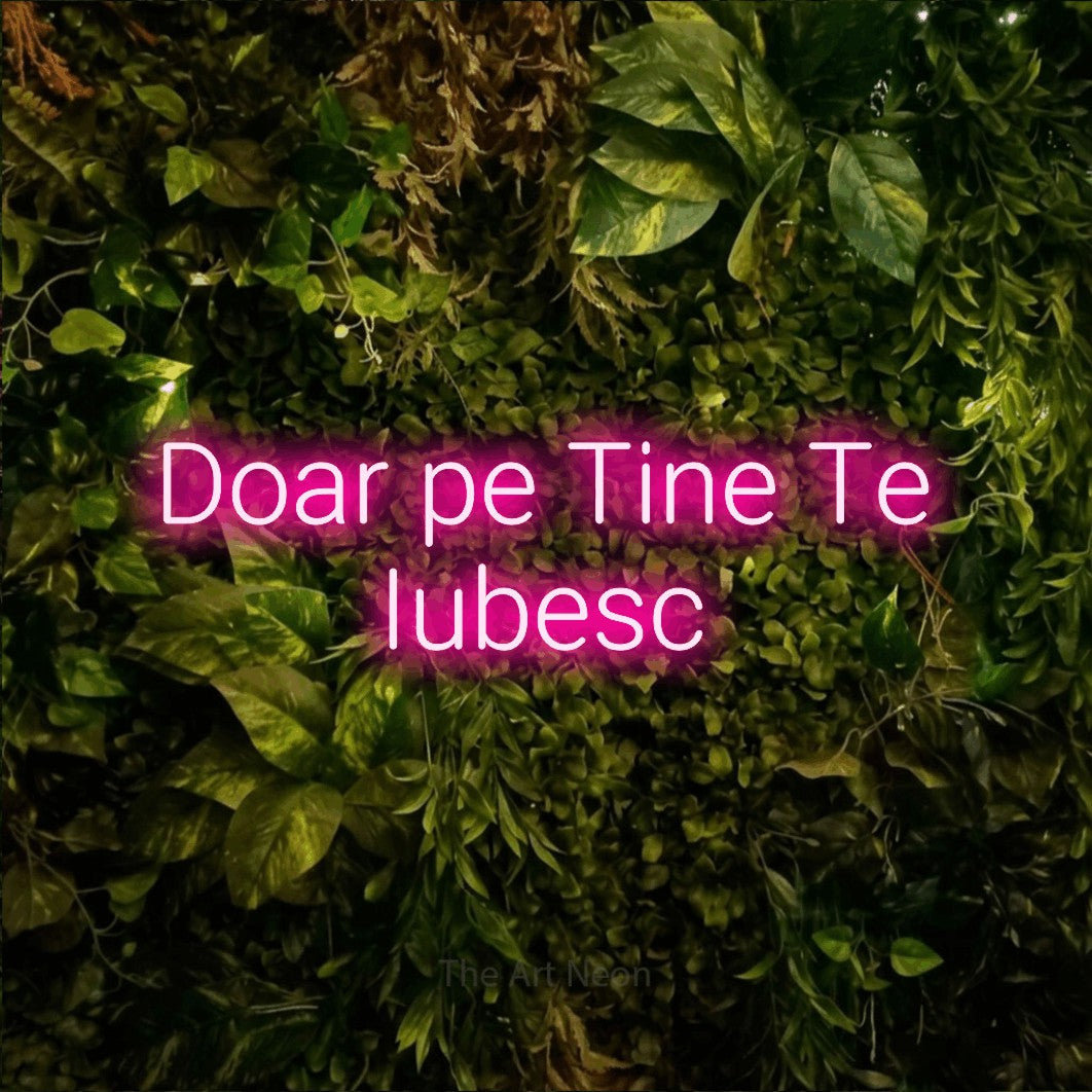 LED neon sign reading “Doar pe Tine Te Iubesc”, arranged in two lines.