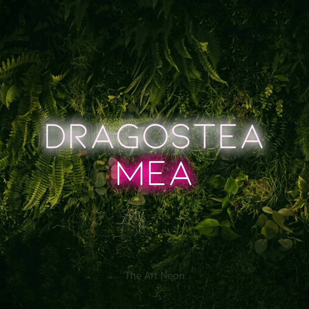 LED neon sign reading “DRAGOSTEA MEA”, arranged in two lines.