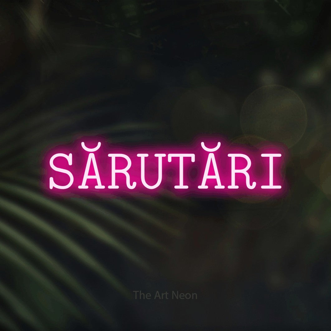 LED neon sign reading “SĂRUTĂRI”, arranged in a single line.