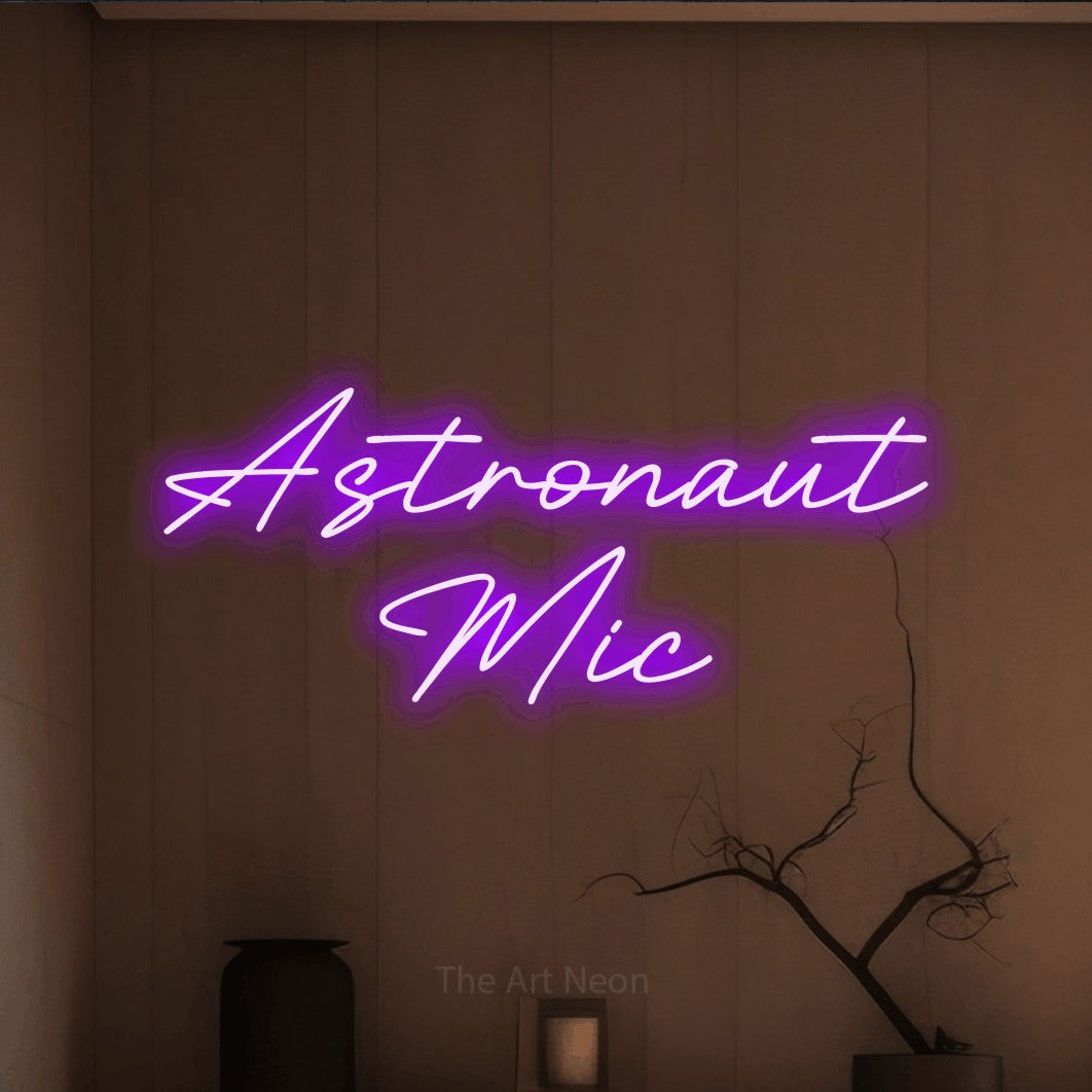 LED neon sign reading “Astronaut Mic”, arranged in two lines.
