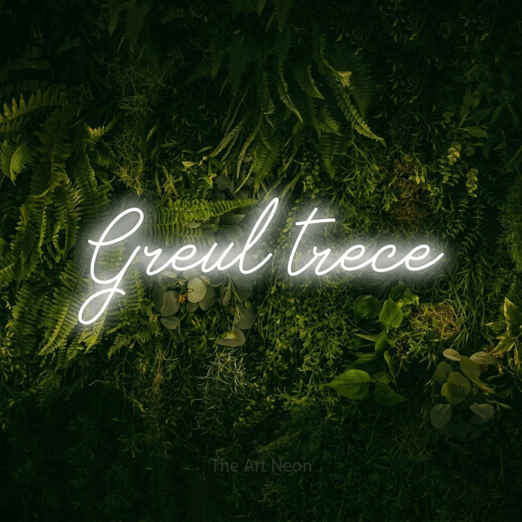 LED neon sign reading “Greul trece”, arranged in a single line.