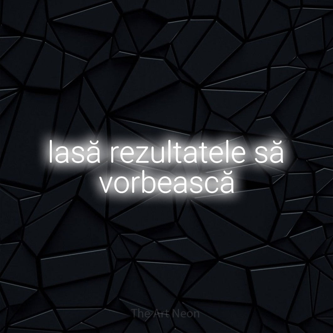 LED neon sign reading “lasă rezultatele să vorbească”, arranged in two lines.