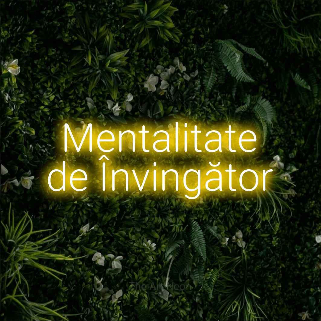 LED neon sign reading “Mentalitate de Învingător”, arranged in two lines.