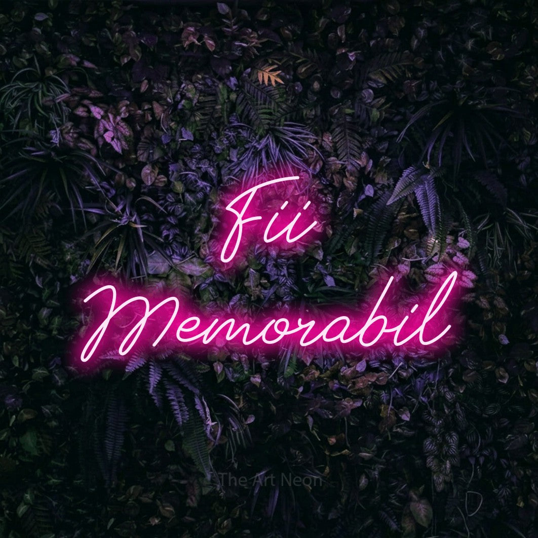 LED neon sign reading “Fii Memorabil”, arranged in two lines.