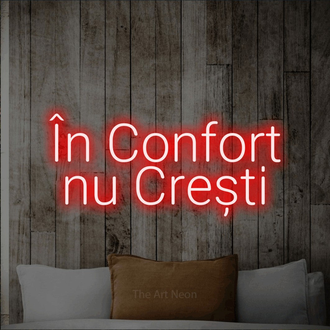 LED neon sign reading “În Confort nu Crești”, arranged in two lines.