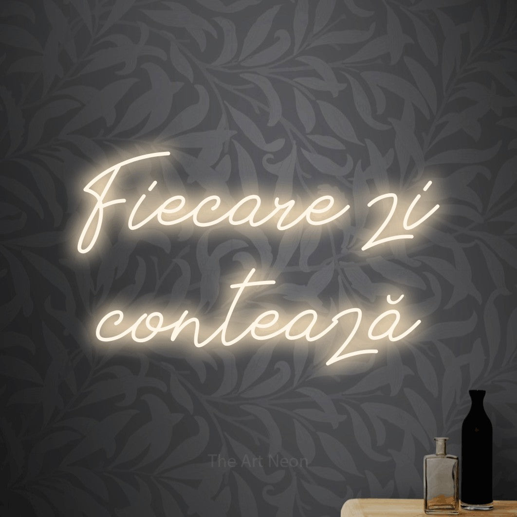 LED neon sign reading “Fiecare zi contează”, arranged in two lines.