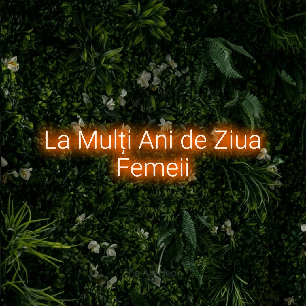 LED neon sign reading “La Mulți Ani de Ziua Femeii”, arranged in two lines.