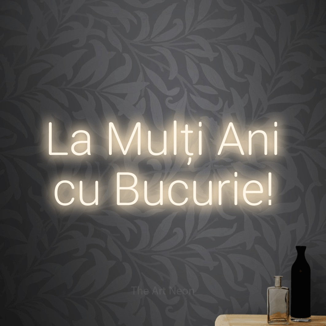 LED neon sign reading “La Mulți Ani cu Bucurie!”, arranged in two lines.