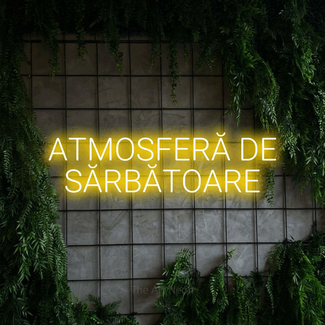 LED neon sign reading “ATMOSFERĂ DE SĂRBĂTOARE”, arranged in two lines.