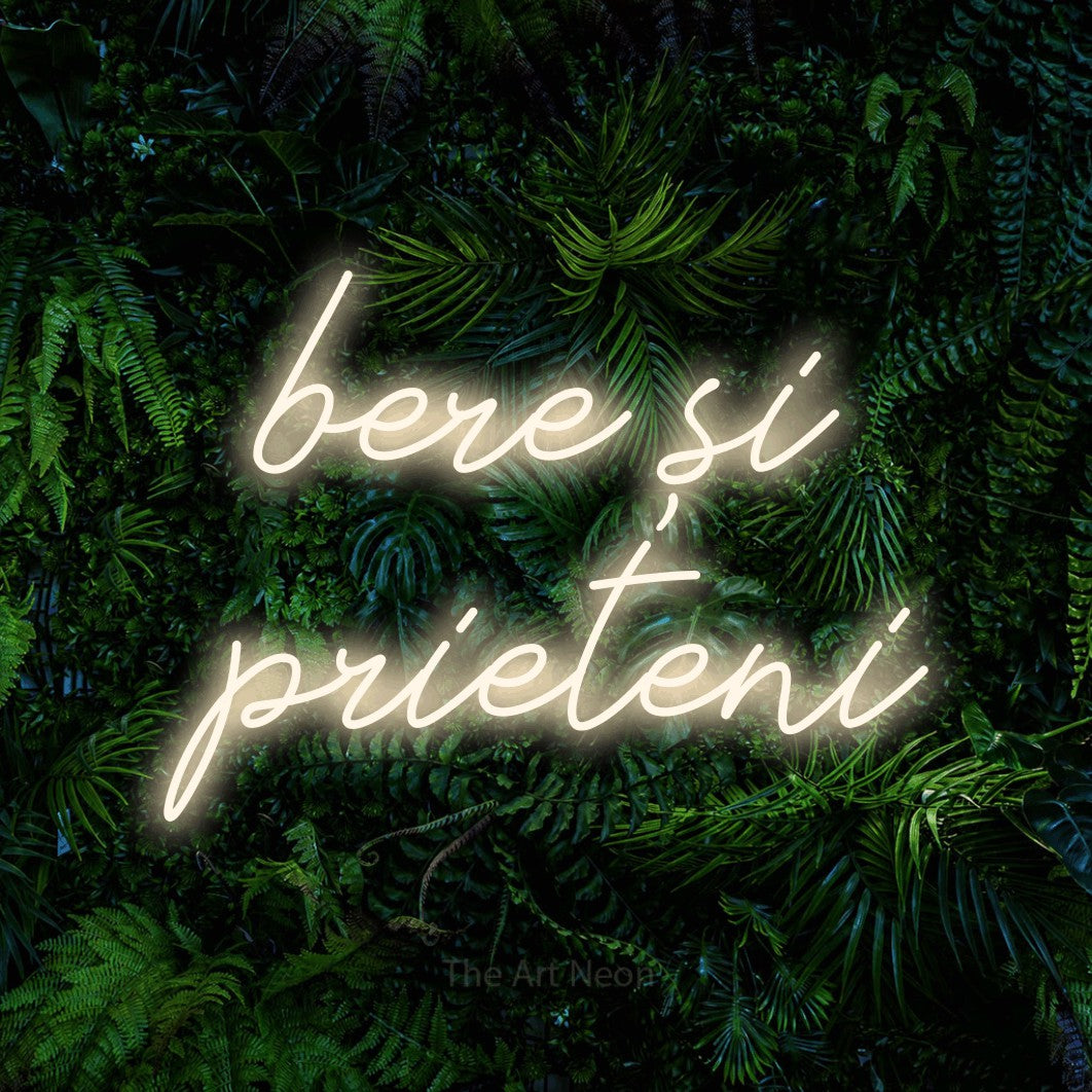 LED neon sign reading “bere și prieteni”, arranged in two lines.