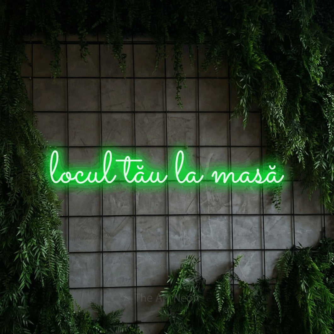 LED neon sign reading “locul tău la masă”, arranged in a single line.