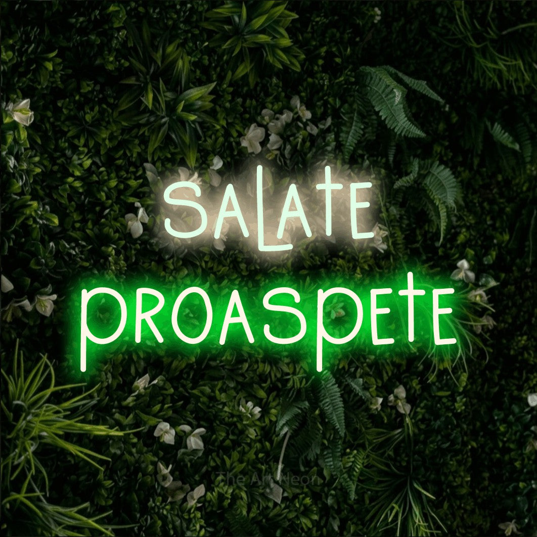 LED neon sign reading “salate proaspete”, arranged in two lines.