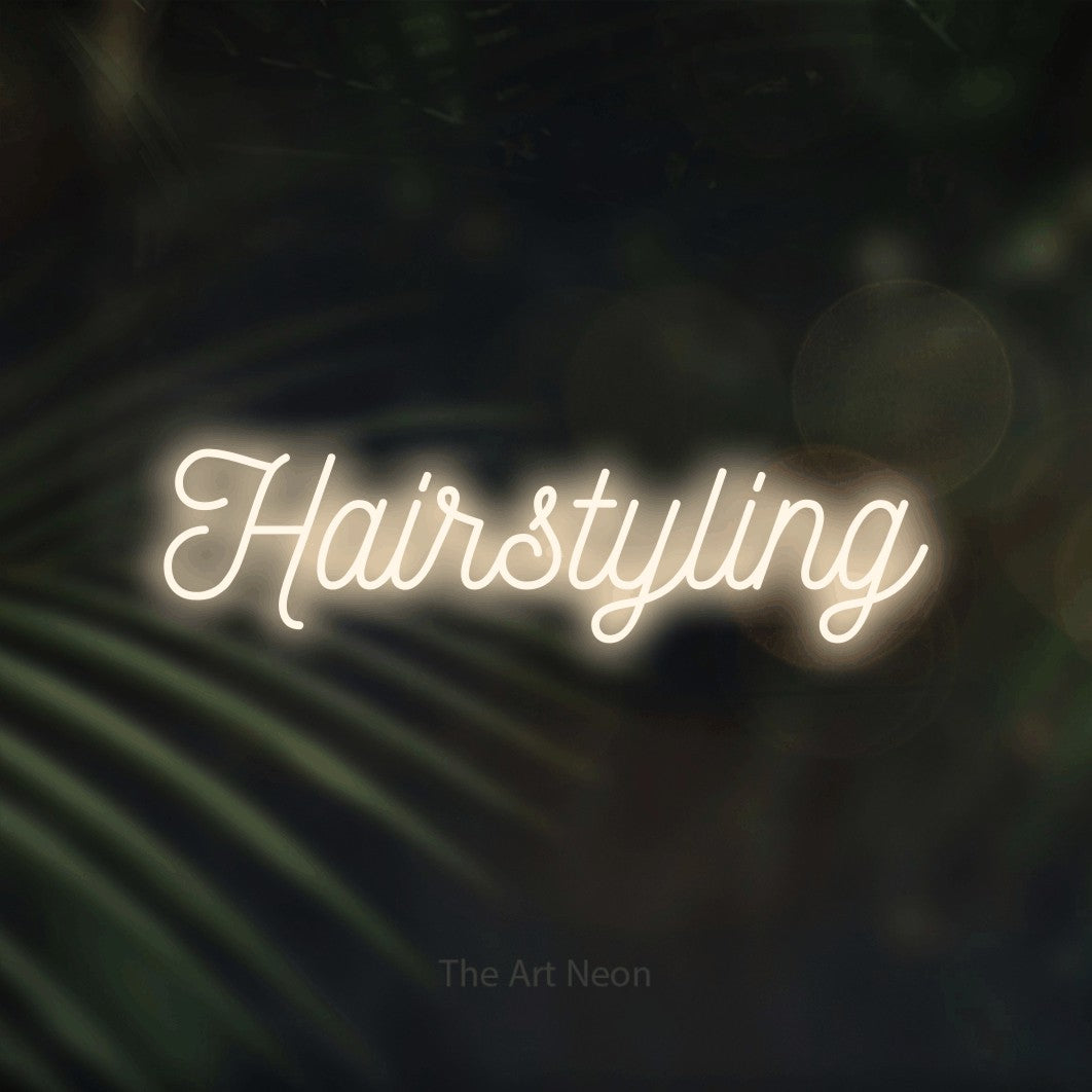 LED neon sign reading “Hairstyling”, arranged in a single line.