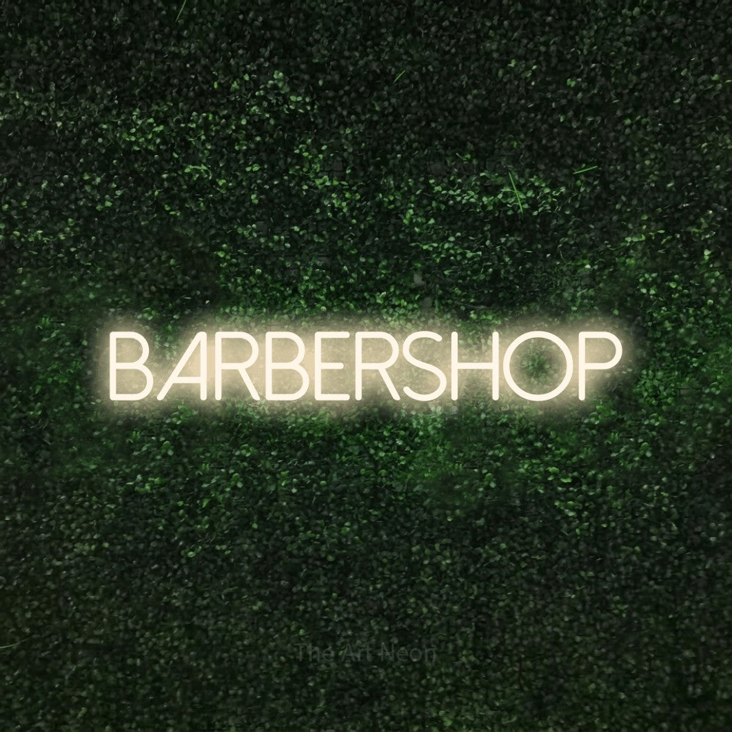 LED neon sign reading “BARBERSHOP”, arranged in a single line.