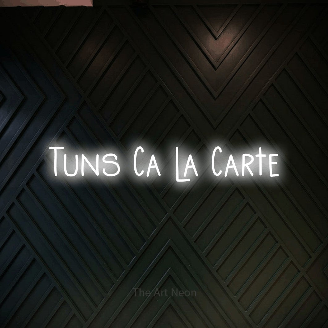 LED neon sign reading “Tuns Ca la Carte”, arranged in a single line.