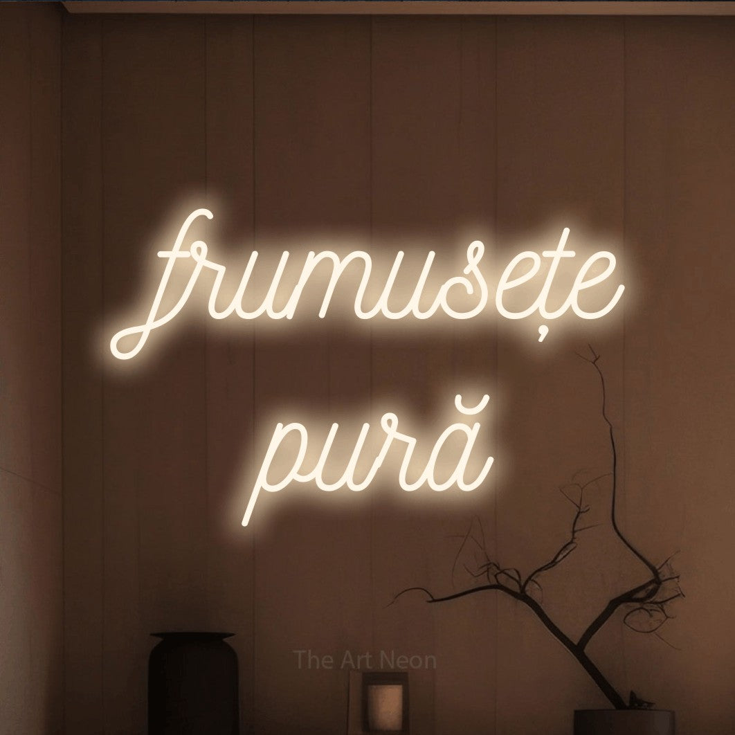 LED neon sign reading “frumusețe pură”, arranged in two lines.