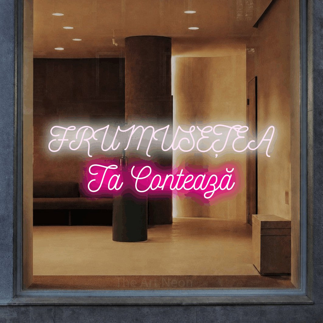 LED neon sign reading “FRUMUSEȚEA Ta Contează”, arranged in two lines.