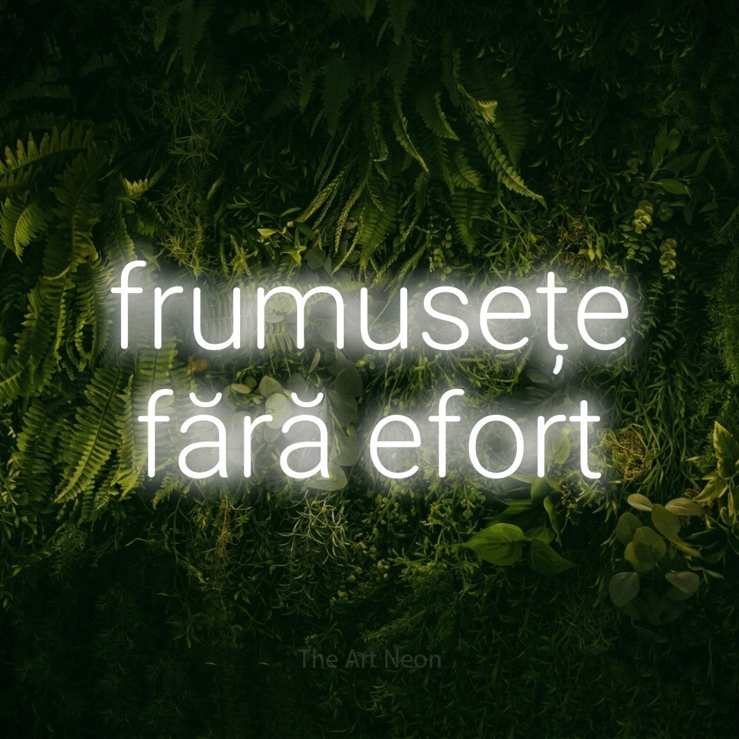 LED neon sign reading “frumusețe fără efort”, arranged in two lines.