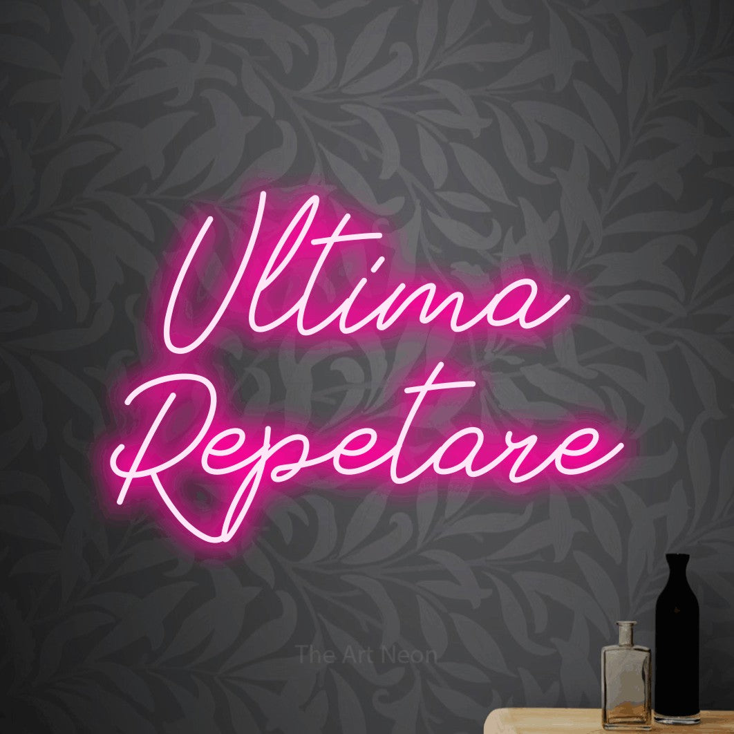LED neon sign reading “Ultima Repetare”, arranged in two lines.