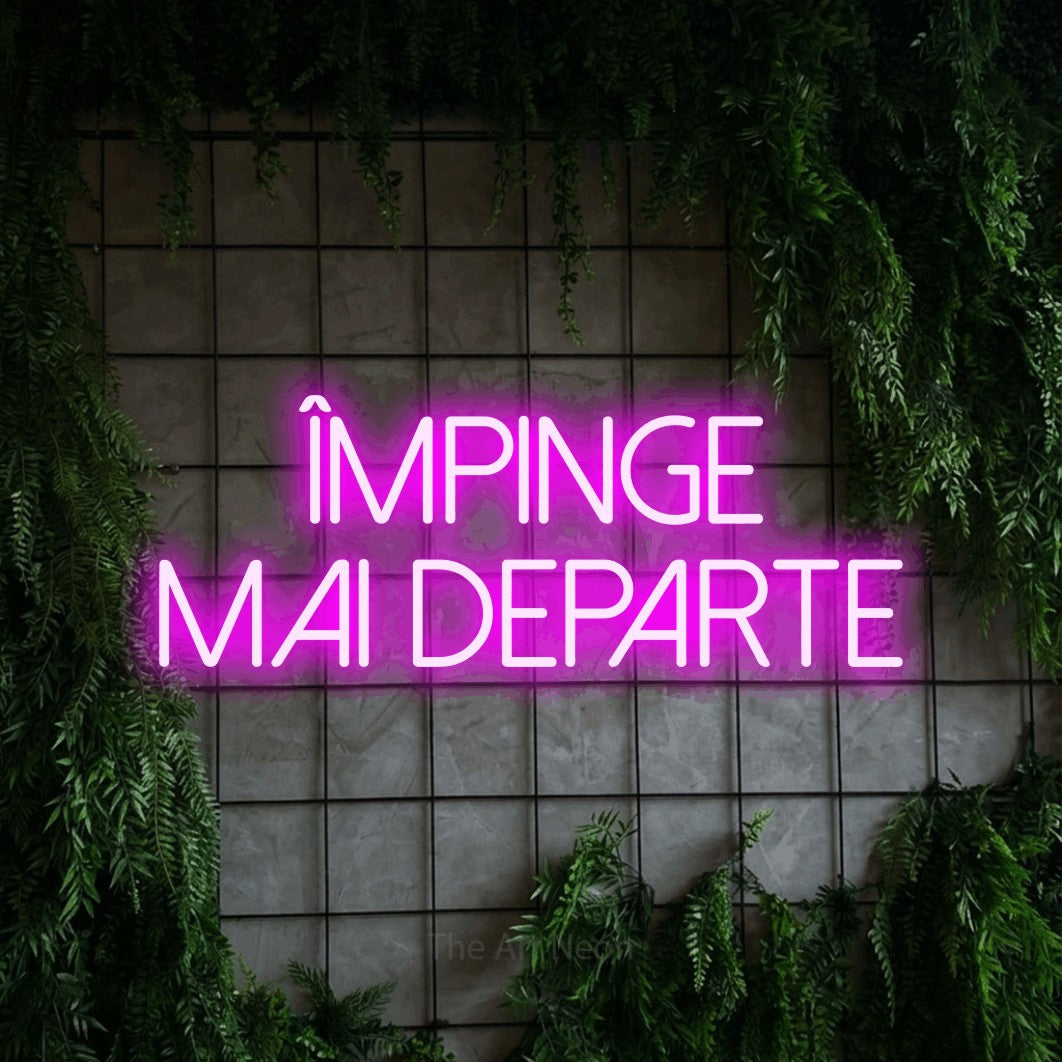 LED neon sign reading “ÎMPINGE MAI DEPARTE”, arranged in two lines.