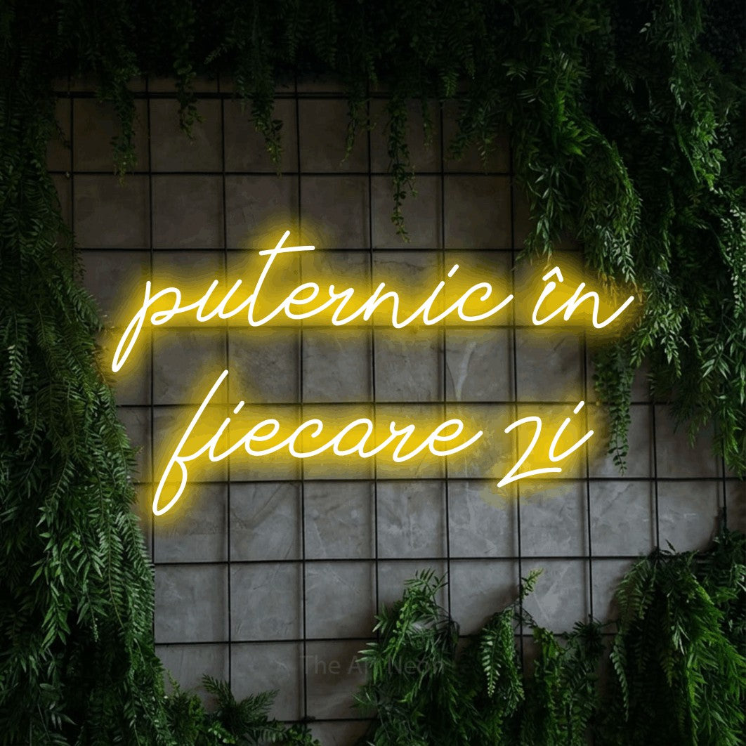 LED neon sign reading “puternic în fiecare zi”, arranged in two lines.
