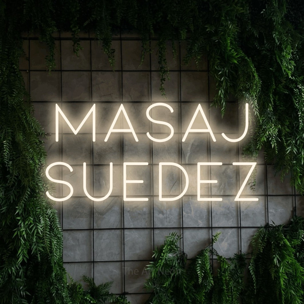 LED neon sign reading “Masaj Suedez”, arranged in two lines.