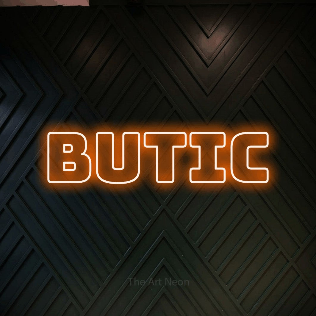 LED neon sign reading “BUTIC”, arranged in a single line.