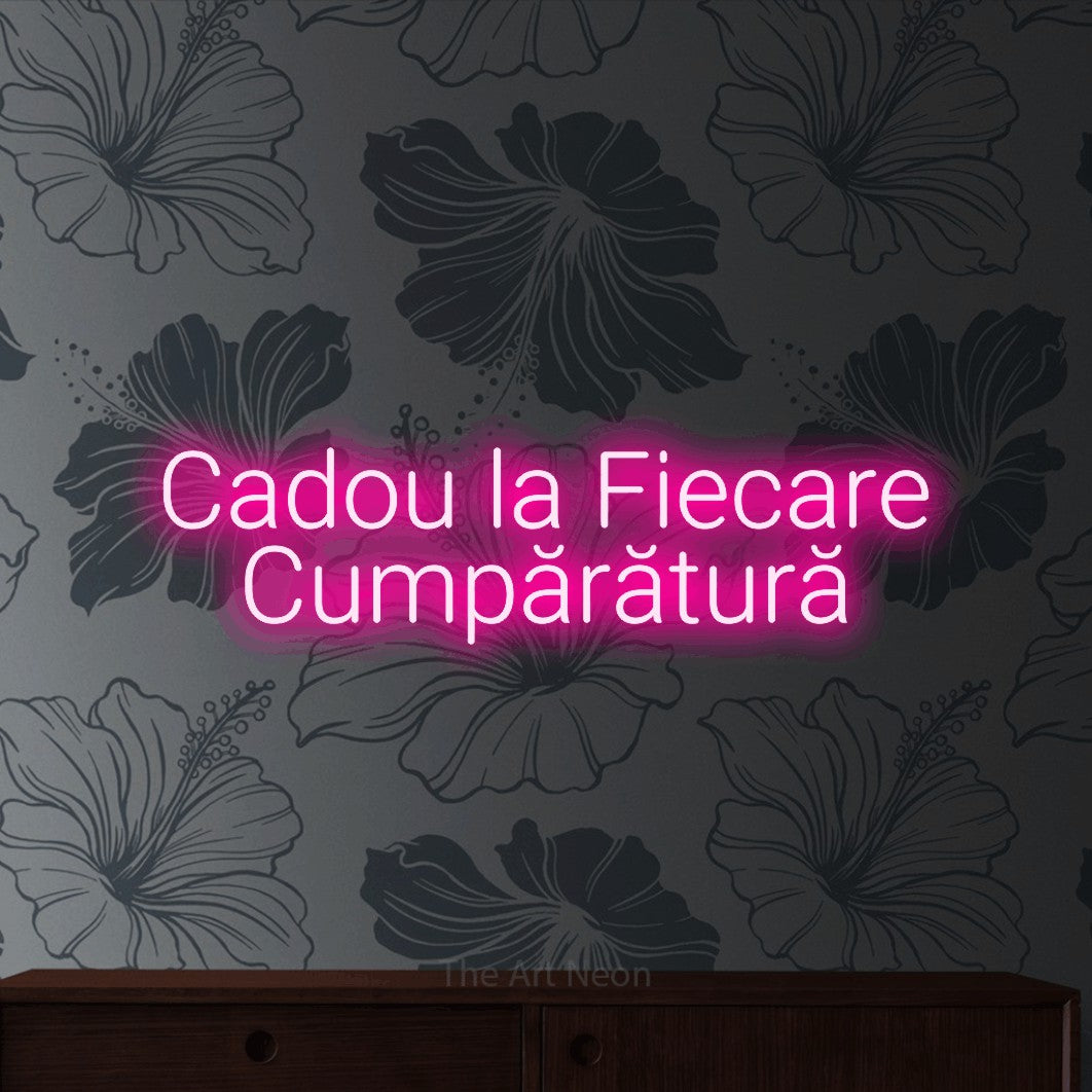 LED neon sign reading “Cadou la Fiecare Cumpărătură”, arranged in two lines.