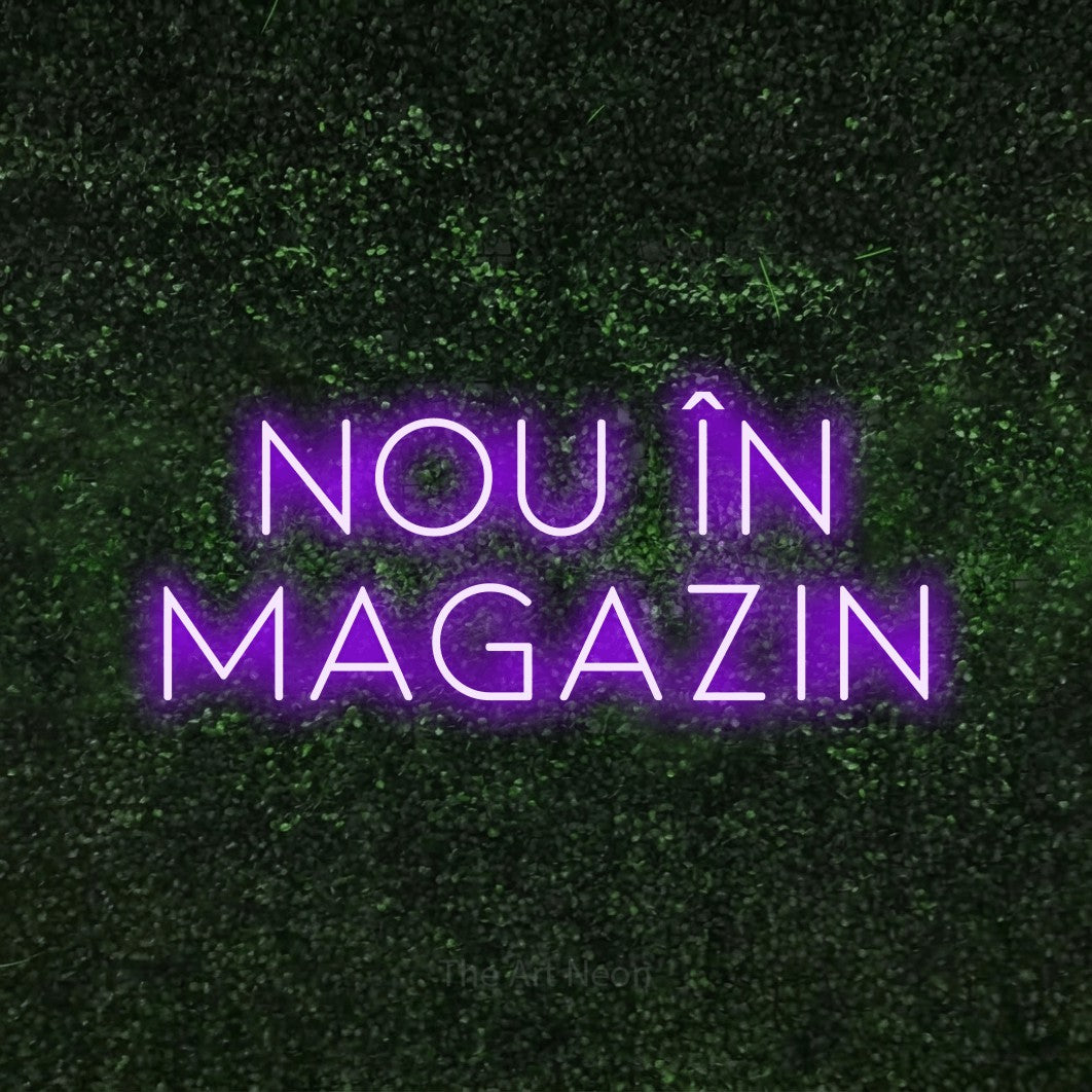 LED neon sign reading “Nou în magazin”, arranged in two lines.