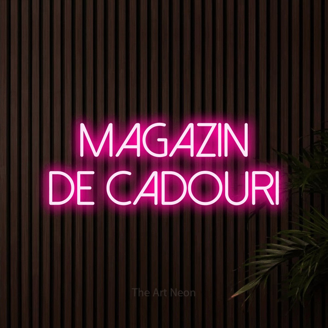 LED neon sign reading “Magazin de Cadouri”, arranged in two lines.